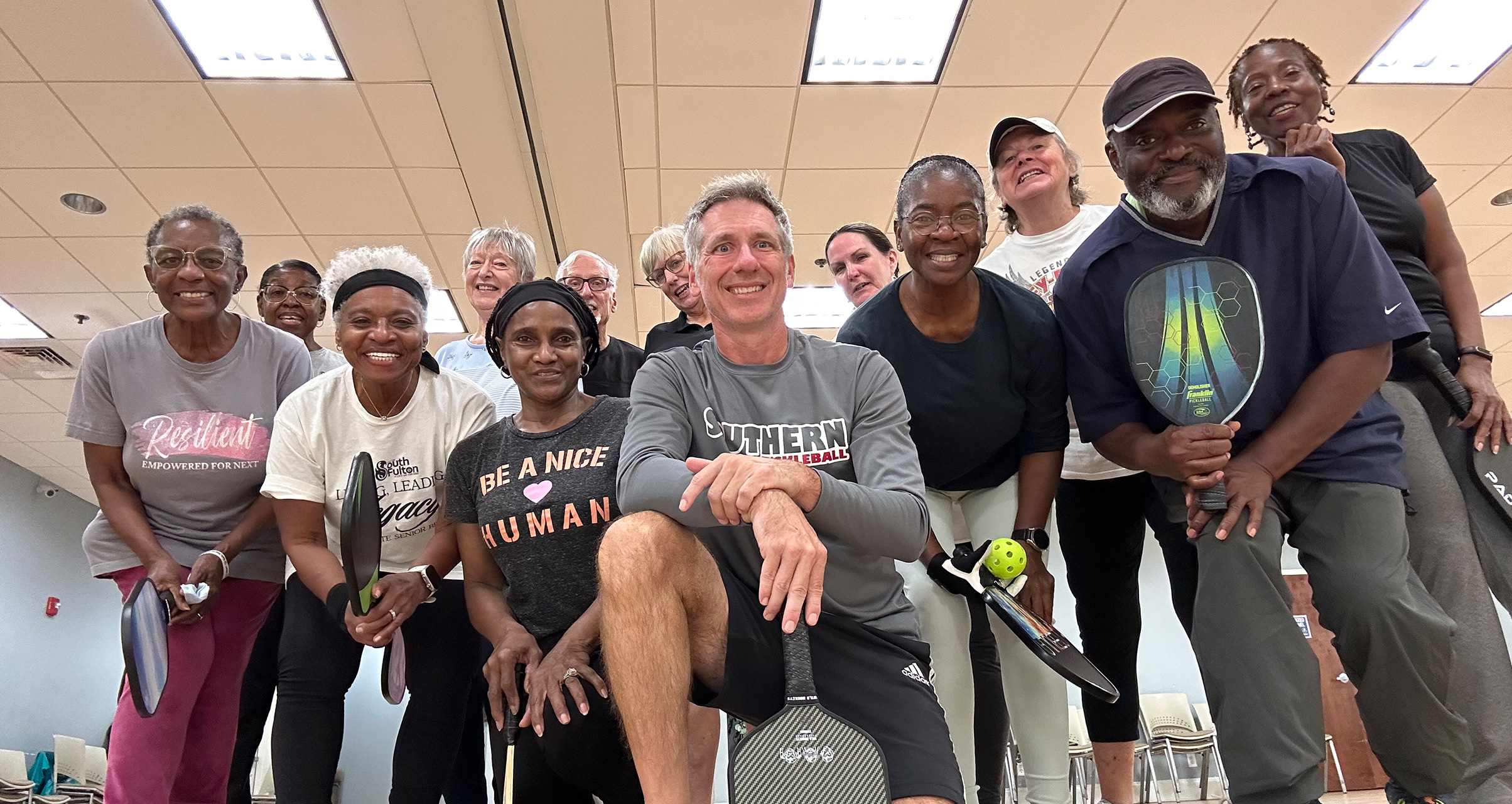 Pickleball players and coach